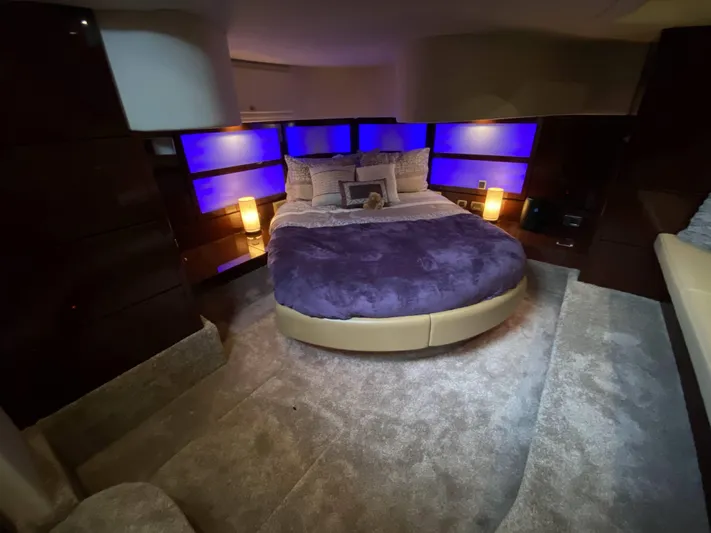 Cheri Pie Yacht Photos Pics Luxurious bedroom interior of 2008 Sea Ray 47 Sedan Bridge yacht with ambient lighting.