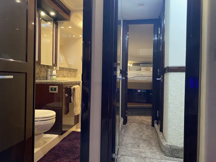 Cheri Pie Yacht Photos Pics Interior of 2008 Sea Ray 47 Sedan Bridge yacht, featuring bathroom and hallway leading to bedroom.