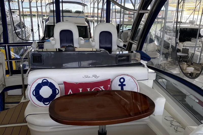 Cheri Pie Yacht Photos Pics 2008 Sea Ray 47 Sedan Bridge interior with helm, seating, and nautical-themed cushions.