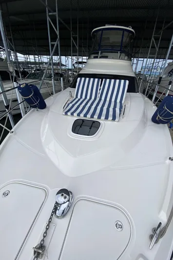 Cheri Pie Yacht Photos Pics 2008 Sea Ray 47 Sedan Bridge yacht with striped sunbed on deck.