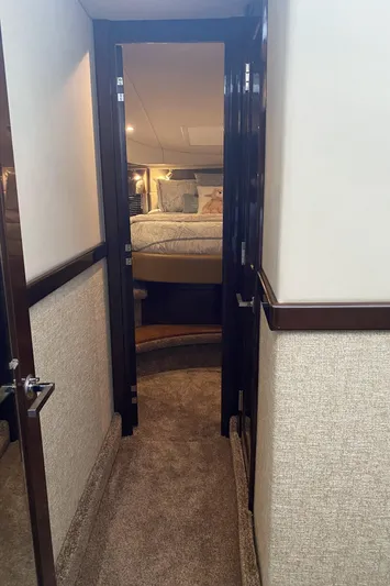 Cheri Pie Yacht Photos Pics Interior hallway of 2008 Sea Ray 47 Sedan Bridge yacht leading to a cozy bedroom.