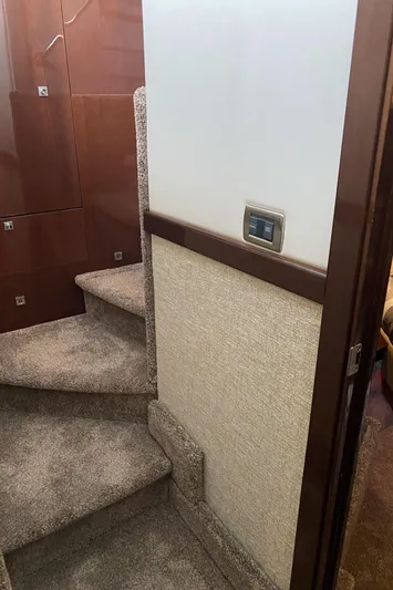 Cheri Pie Yacht Photos Pics Interior staircase of 2008 Sea Ray 47 Sedan Bridge yacht with carpeted steps.