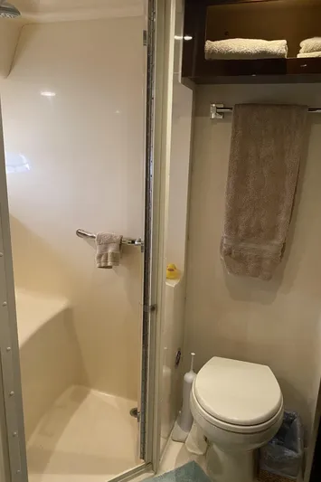 Cheri Pie Yacht Photos Pics 2008 Sea Ray 47 Sedan Bridge bathroom with shower, toilet, and towel rack.