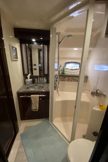 Cheri Pie Yacht Photos Pics 2008 Sea Ray 47 Sedan Bridge bathroom with shower, sink, and mirror.