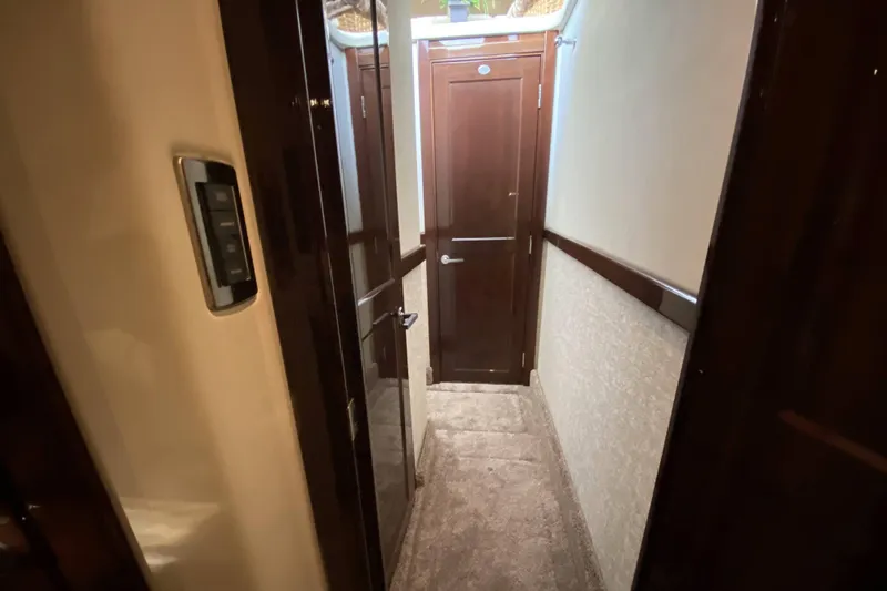 Cheri Pie Yacht Photos Pics Hallway inside 2008 Sea Ray 47 Sedan Bridge yacht with wooden doors and paneling.