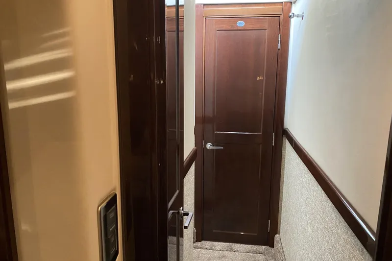 Cheri Pie Yacht Photos Pics Interior hallway of 2008 Sea Ray 47 Sedan Bridge with wooden doors.