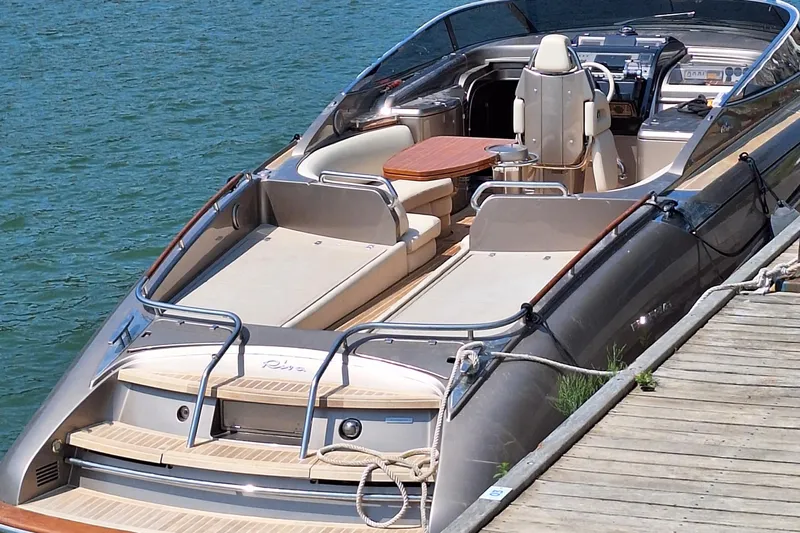 Frida Yacht Photos Pics 2007 Riva Rivarama luxury yacht docked, featuring elegant design and spacious seating.