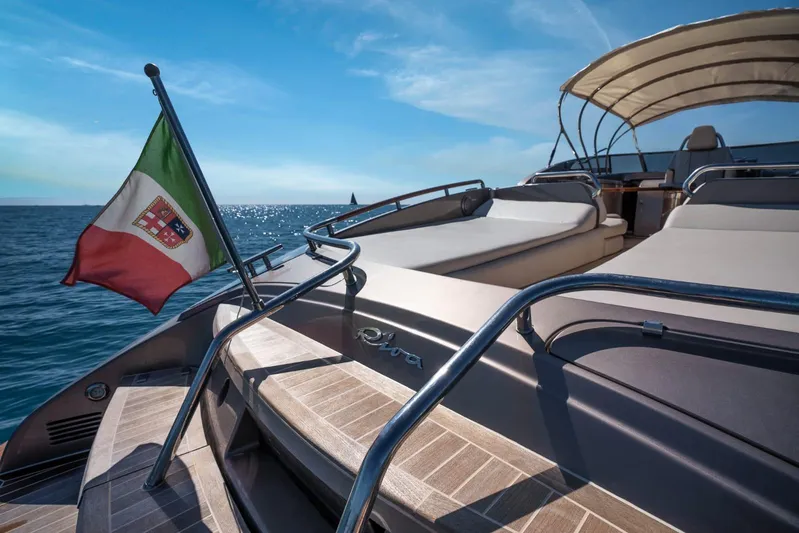 Frida Yacht Photos Pics Luxurious 2007 Riva Rivarama yacht with Italian flag, cruising on a sunny day.