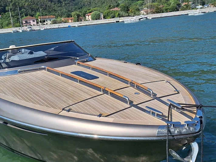 Frida Yacht Photos Pics Luxury 2007 Riva Rivarama yacht on serene water with scenic background.