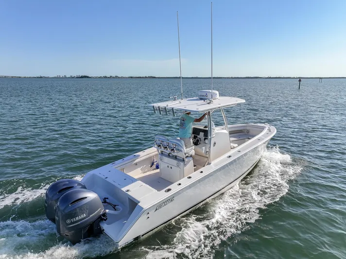  Yacht Photos Pics 2018 Jupiter 26 FS boat cruising on open water with dual Yamaha engines.
