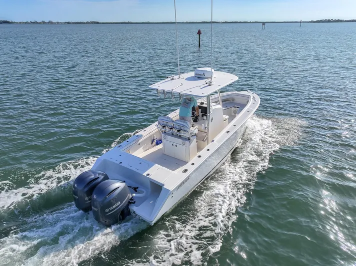  Yacht Photos Pics 2018 Jupiter 26 FS boat cruising on open water with twin engines.