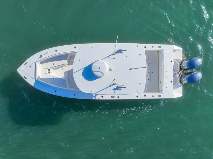  Yacht Photos Pics Aerial view of 2018 Jupiter 26 FS boat on turquoise water.