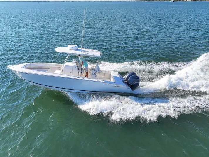  Yacht Photos Pics 2018 Jupiter 26 FS boat cruising on open water, creating a wake.