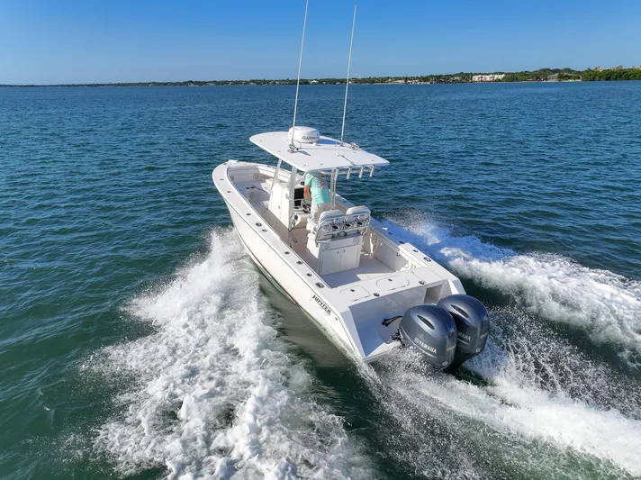  Yacht Photos Pics 2018 Jupiter 26 FS boat cruising on open water with twin engines.