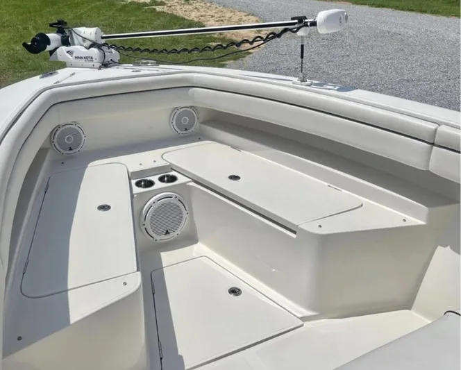  Yacht Photos Pics 2018 Jupiter 26 FS boat interior with seating, speakers, and storage compartments.