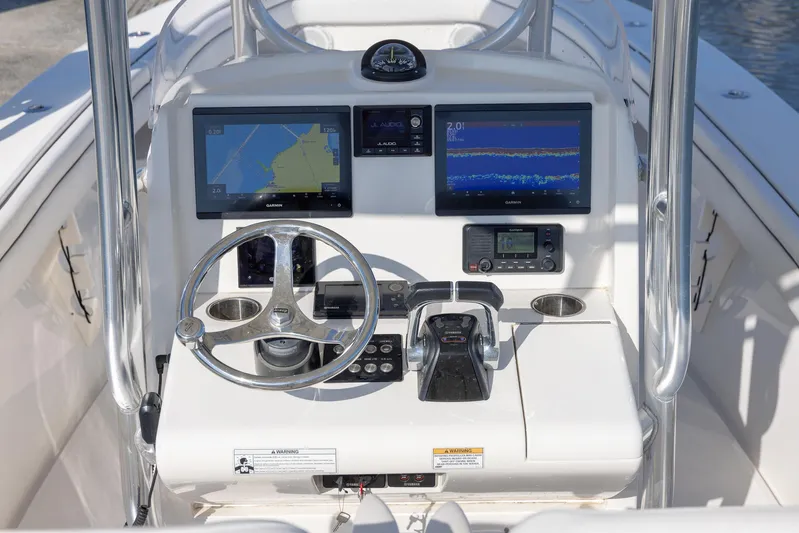  Yacht Photos Pics 2018 Jupiter 26 FS boat console with dual navigation screens and steering wheel.