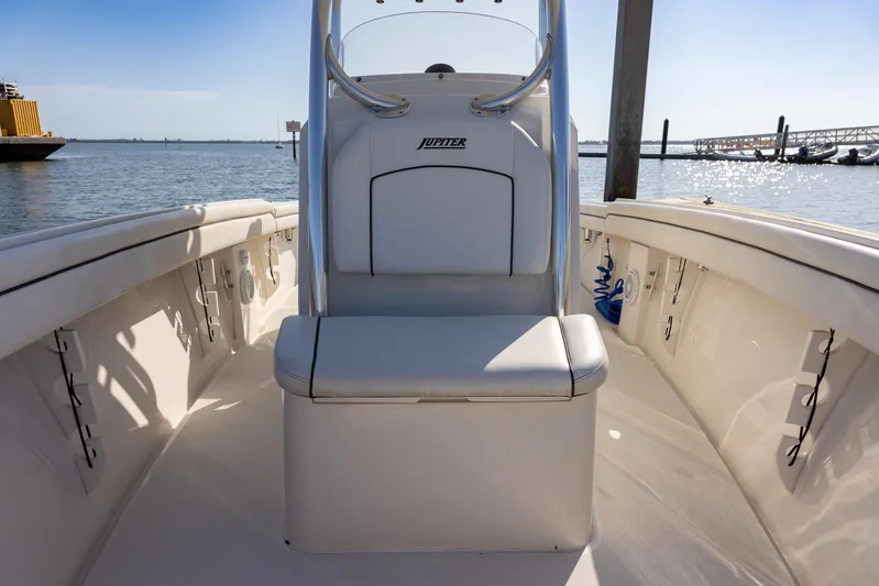 Yacht Photos Pics 2018 Jupiter 26 FS boat interior with seating, docked by the water.