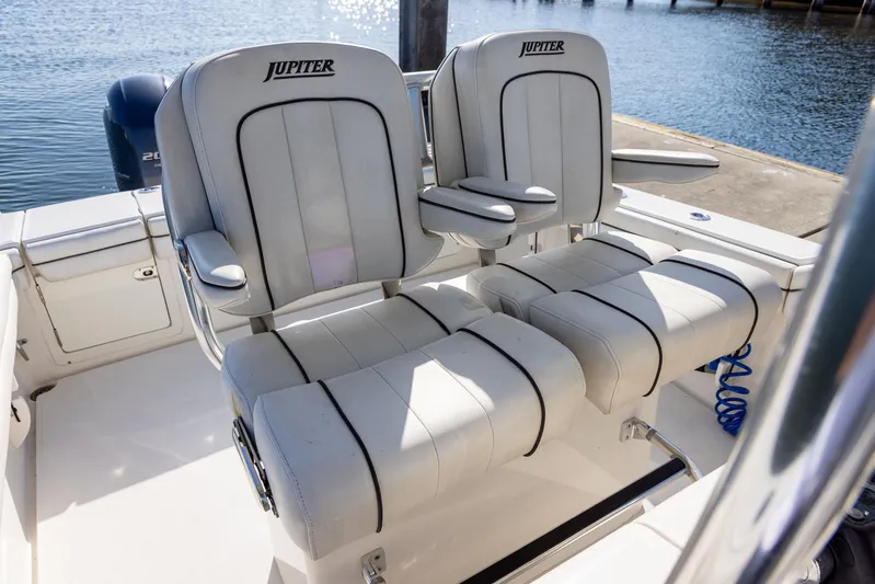  Yacht Photos Pics 2018 Jupiter 26 FS boat seats, white with black trim, docked by the water.
