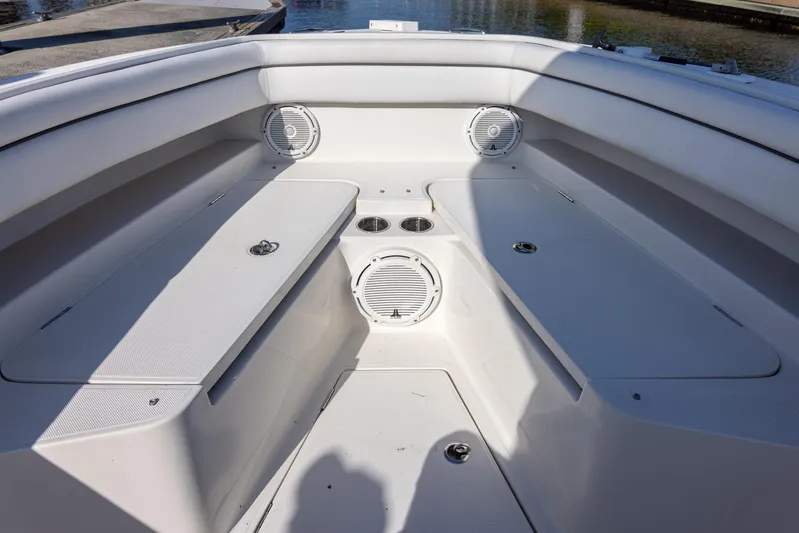  Yacht Photos Pics Bow seating area of 2018 Jupiter 26 FS boat with speakers and cup holders.