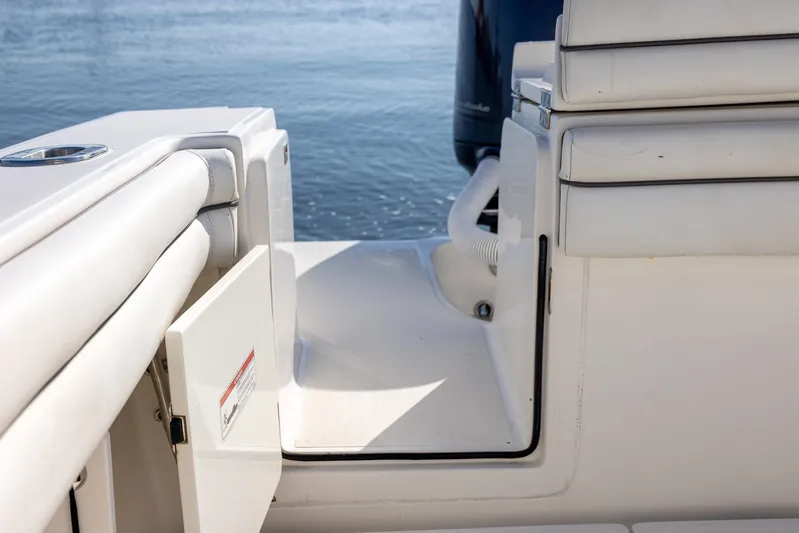  Yacht Photos Pics 2018 Jupiter 26 FS boat interior with open hatch, white seating, and water view.