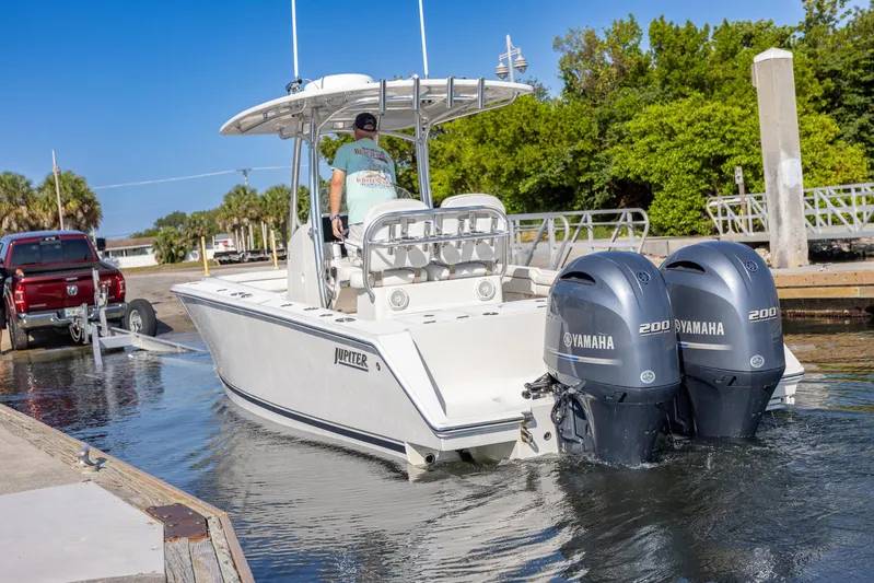  Yacht Photos Pics 2018 Jupiter 26 FS boat with dual Yamaha engines launching from a dock.