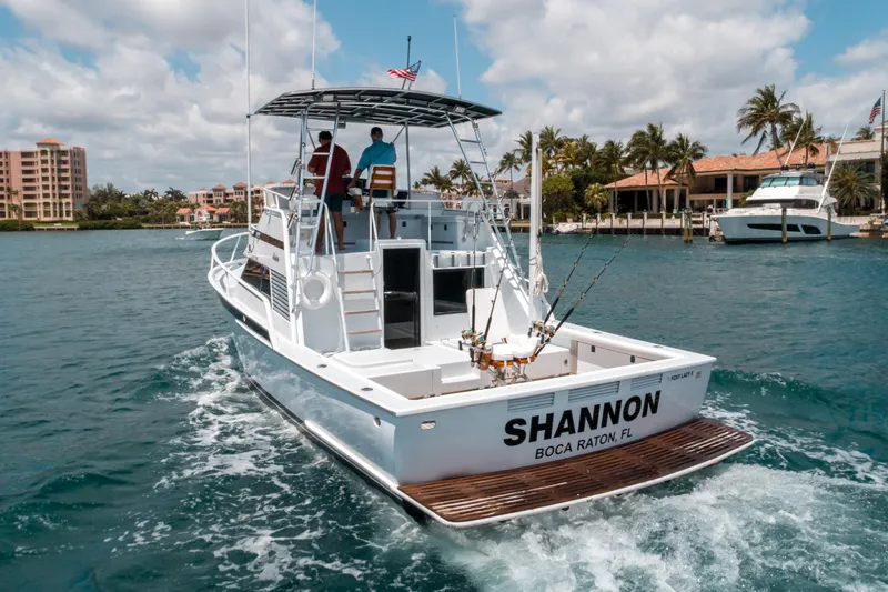 Shannon Yacht Photos Pics 1973 Striker 34 Canyon Runner boat cruising in Boca Raton, Florida waters.