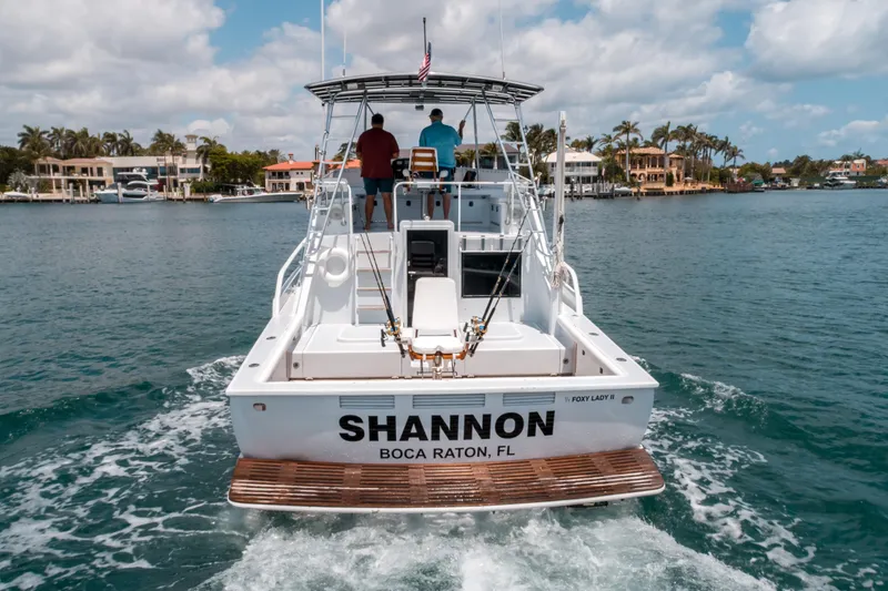 Shannon Yacht Photos Pics 1973 Striker 34 Canyon Runner boat cruising in Boca Raton, Florida waters.