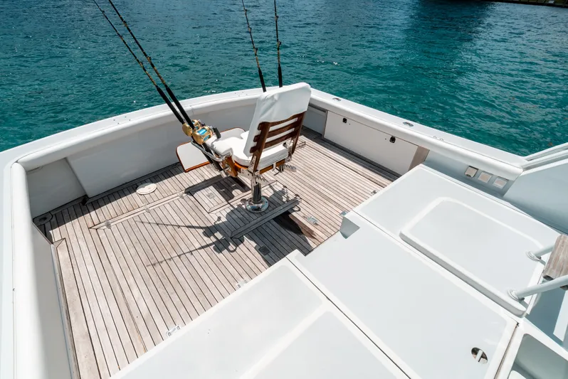 Shannon Yacht Photos Pics 1973 Striker 34 Canyon Runner fishing deck with chair, set against blue water.