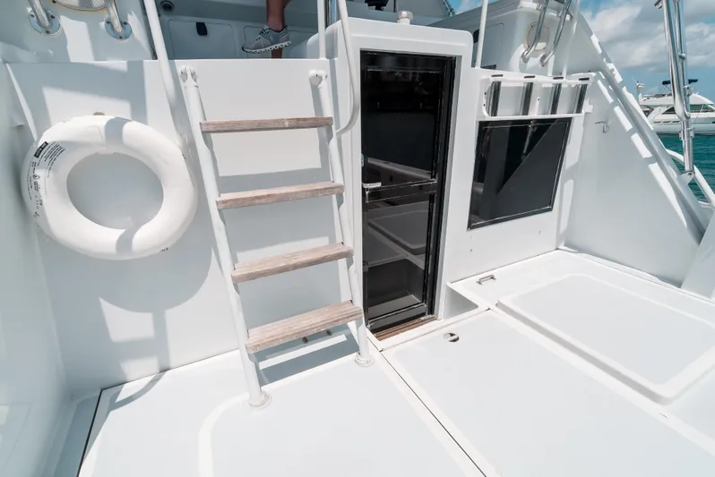 Shannon Yacht Photos Pics 1973 Striker 34 Canyon Runner boat deck with ladder and life preserver.