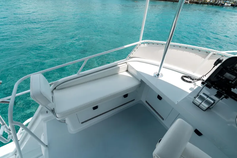 Shannon Yacht Photos Pics 1973 Striker 34 Canyon Runner boat deck with white seating and turquoise water background.