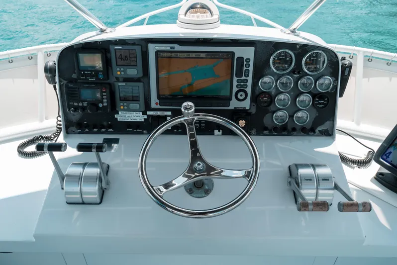 Shannon Yacht Photos Pics Control panel of a 1973 Striker 34 Canyon Runner boat with navigation instruments.