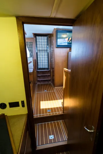 Shannon Yacht Photos Pics Interior view of 1973 Striker 34 Canyon Runner with wooden flooring and cozy cabin.