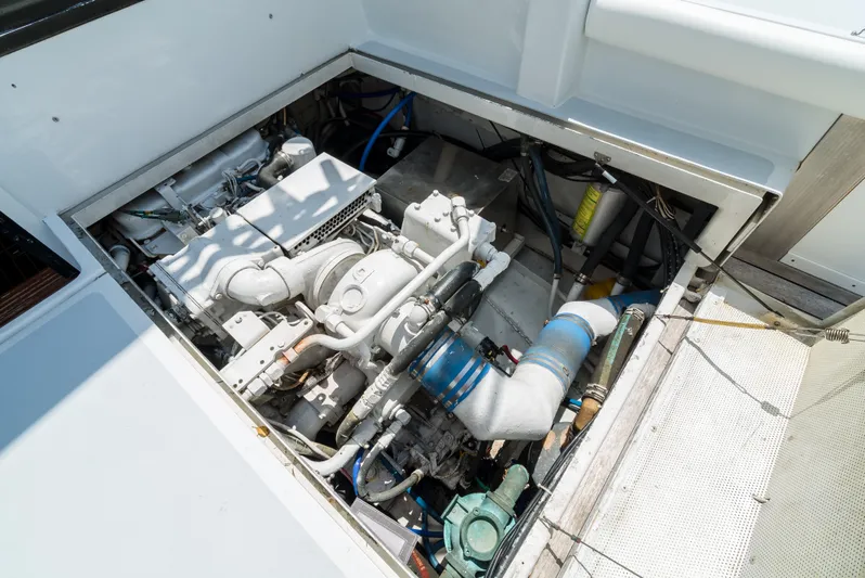 Shannon Yacht Photos Pics Engine compartment of a 1973 Striker 34 Canyon Runner boat, showcasing mechanical components.