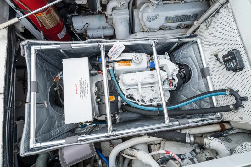 Shannon Yacht Photos Pics Engine compartment of a 1973 Striker 34 Canyon Runner boat, featuring detailed mechanical components.