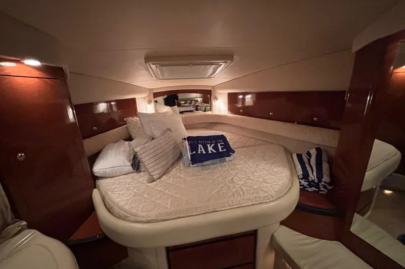 Dulce Vita Yacht Photos Pics Luxurious cabin interior of 2003 Sea Ray 340 Sundancer yacht with cozy bedding.