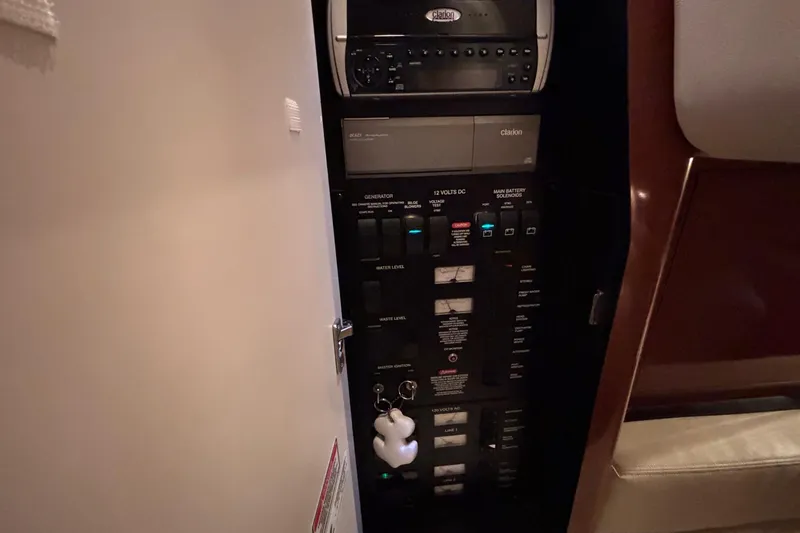 Dulce Vita Yacht Photos Pics Electrical panel inside 2003 Sea Ray 340 Sundancer boat, featuring various switches and controls.