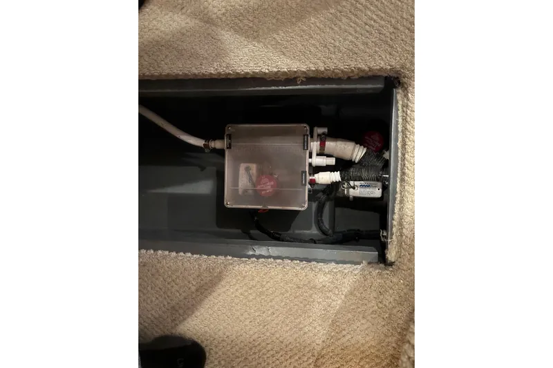 Dulce Vita Yacht Photos Pics Bilge compartment of 2003 Sea Ray 340 Sundancer with visible pump and wiring.