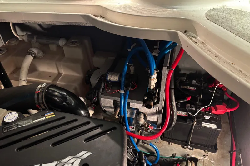 Dulce Vita Yacht Photos Pics Engine compartment of a 2003 Sea Ray 340 Sundancer with visible wiring and components.