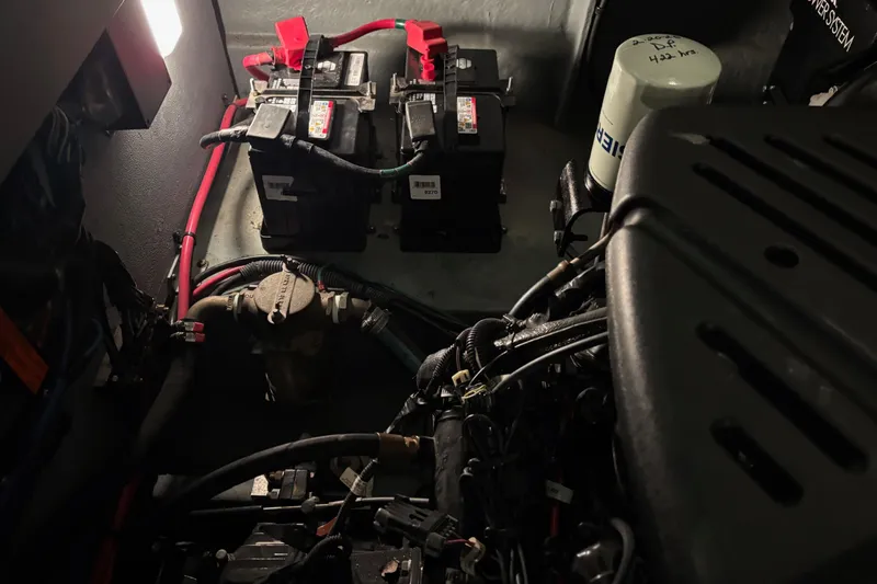 Dulce Vita Yacht Photos Pics Engine compartment of a 2003 Sea Ray 340 Sundancer with visible batteries and wiring.