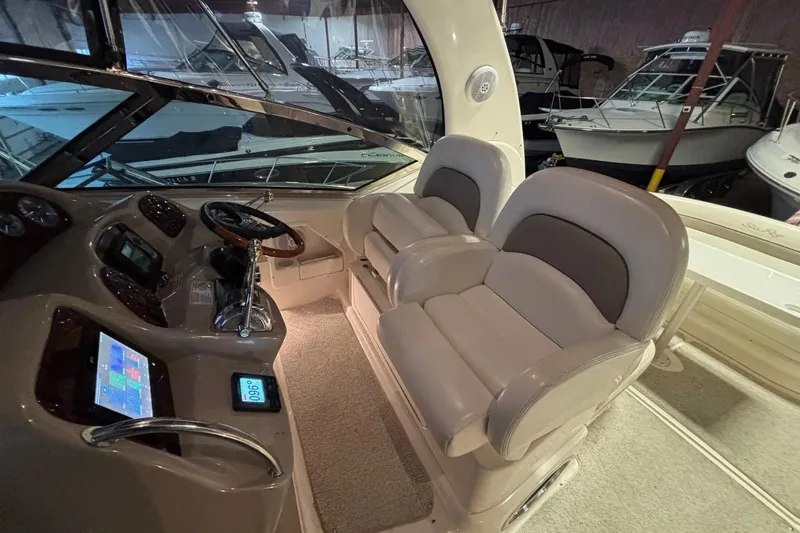 Dulce Vita Yacht Photos Pics 2003 Sea Ray 340 Sundancer helm with dual seats and navigation controls.