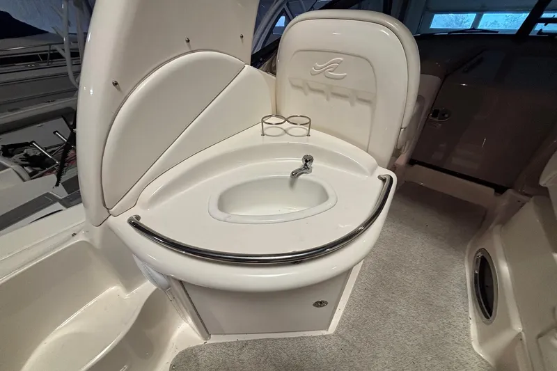 Dulce Vita Yacht Photos Pics 2003 Sea Ray 340 Sundancer boat interior with sink and cup holders.