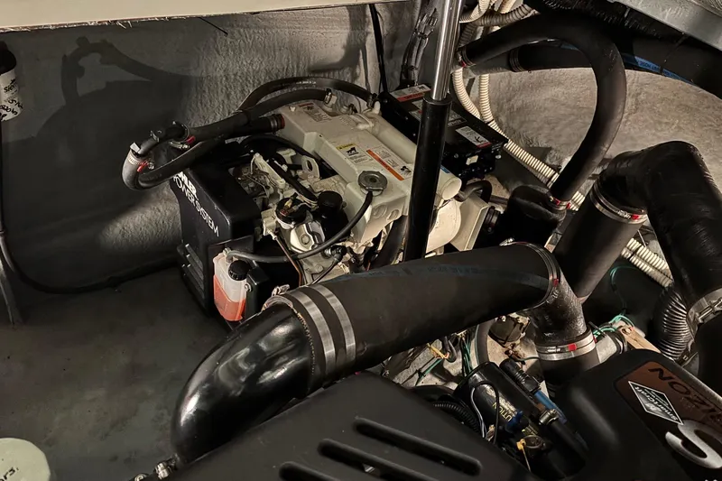 Dulce Vita Yacht Photos Pics Engine compartment of a 2003 Sea Ray 340 Sundancer with visible components and hoses.