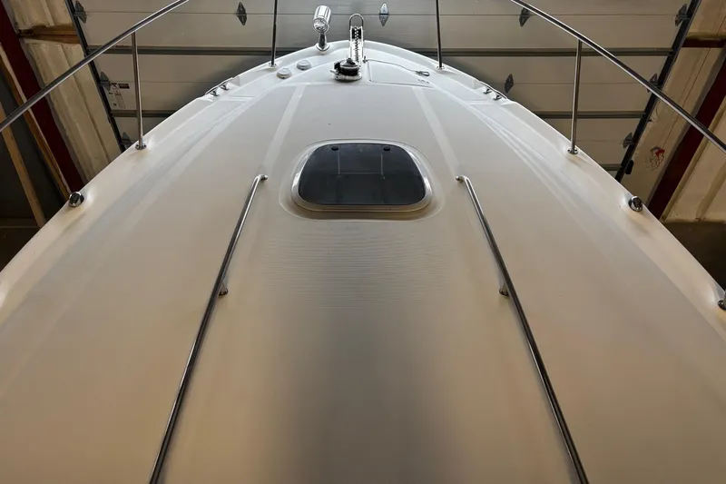 Dulce Vita Yacht Photos Pics 2003 Sea Ray 340 Sundancer boat deck with railing and hatch, indoors.