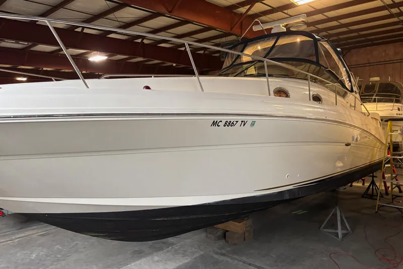 Dulce Vita Yacht Photos Pics 2003 Sea Ray 340 Sundancer boat in indoor storage facility.