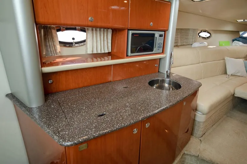  Yacht Photos Pics 2007 Formula 370 Super Sport yacht interior with kitchenette and seating area.