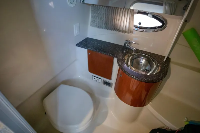  Yacht Photos Pics Compact bathroom in 2007 Formula 370 Super Sport boat with sink and toilet.