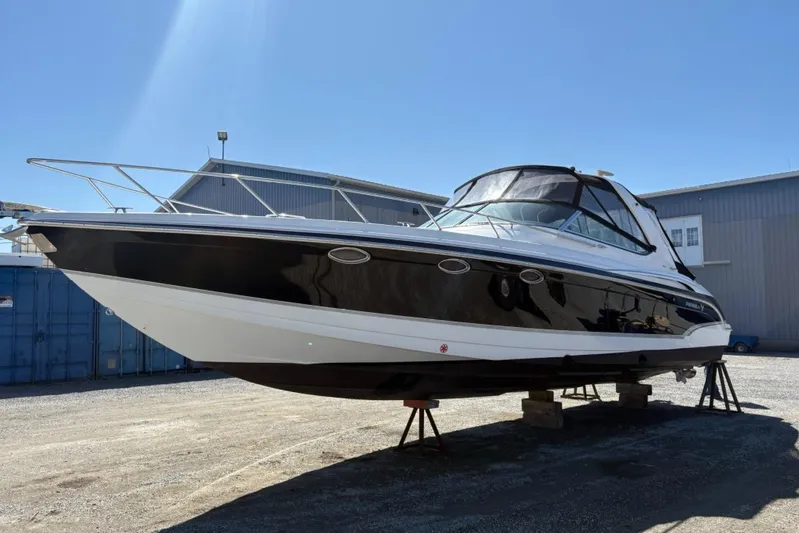  Yacht Photos Pics 2007 Formula 370 Super Sport boat on stands, black and white exterior, sunny day.