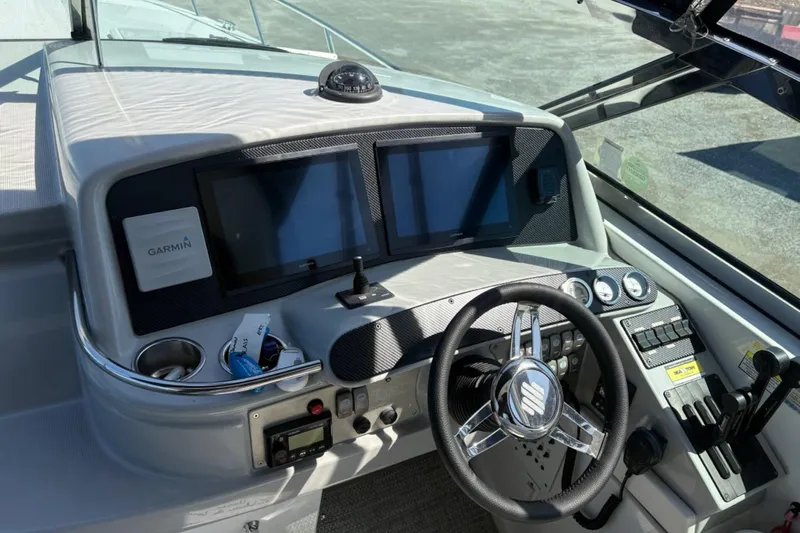  Yacht Photos Pics 2007 Formula 370 Super Sport boat dashboard with Garmin navigation system and steering wheel.