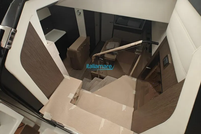  Yacht Photos Pics Interior view of 2018 Cranchi 60 ST yacht staircase, featuring modern design elements.