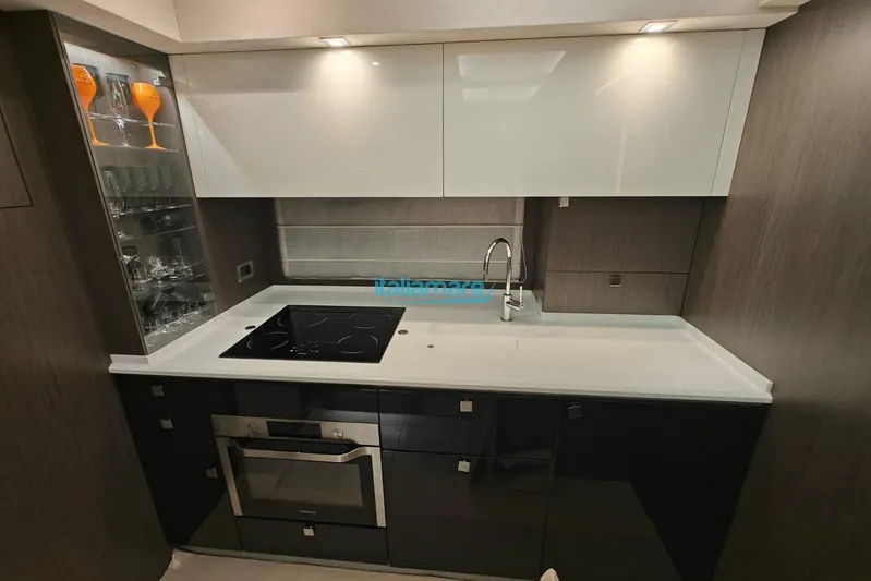  Yacht Photos Pics Modern kitchen in 2018 Cranchi 60 ST yacht with sleek cabinetry and appliances.